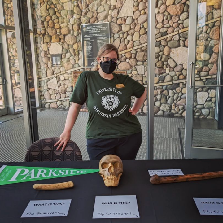 University of Wisconsin Parkside Student posing with a skull