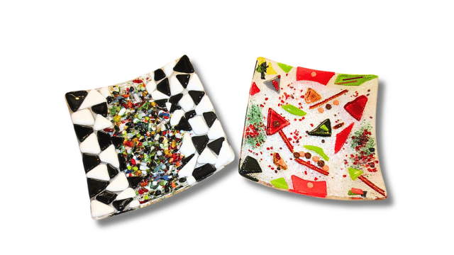 Two colorful glass mosaic plates with geometric designs.